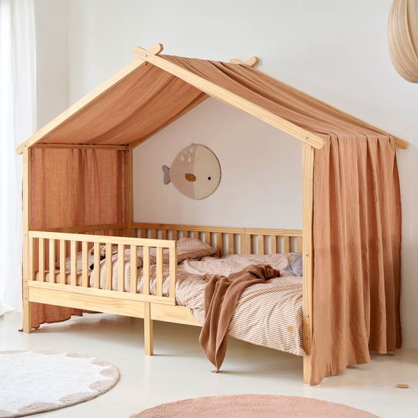 Bed house canopy with tan fabric curtain from Petite Amélie