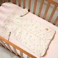 Winter baby sleeping bag with pansy pattern in jersey cotton for 3 to 6 months from Petite Amélie
